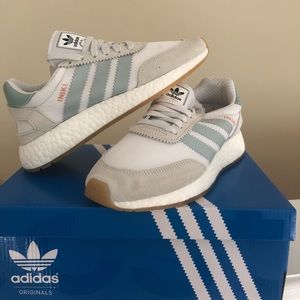 Adidas Iniki. Brand new, never worn. Size 6.
